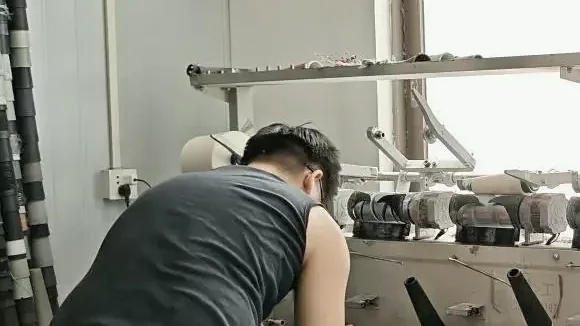Yarn winding and waxing equipment used before computerized flat knitting