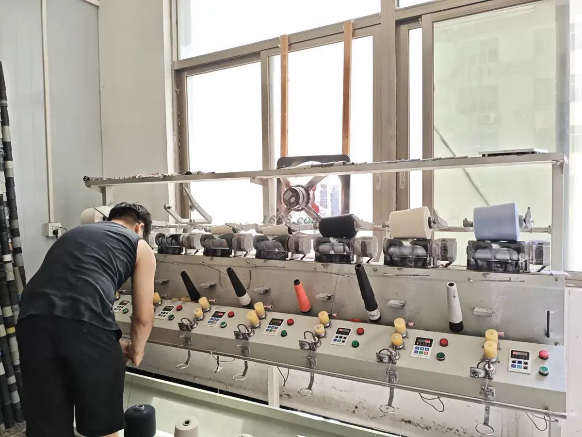 Yarn winding preparation for custom knitwear production at TYKNIT