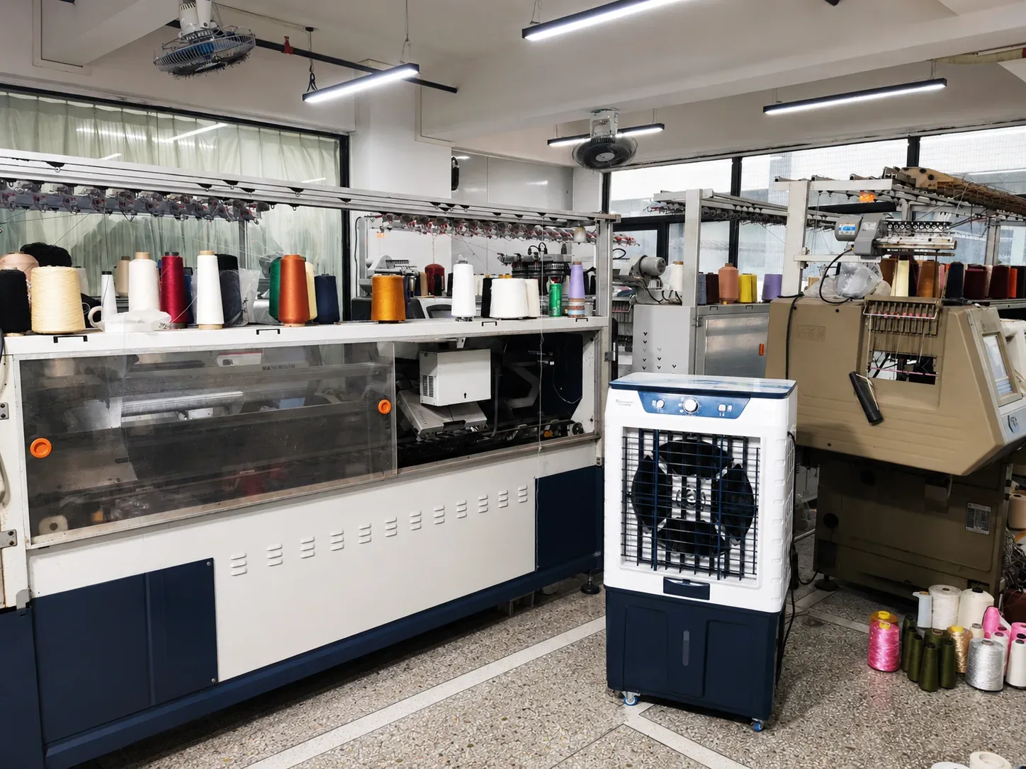 TYKNIT computerized flat knitting machines in a real knitwear production workshop